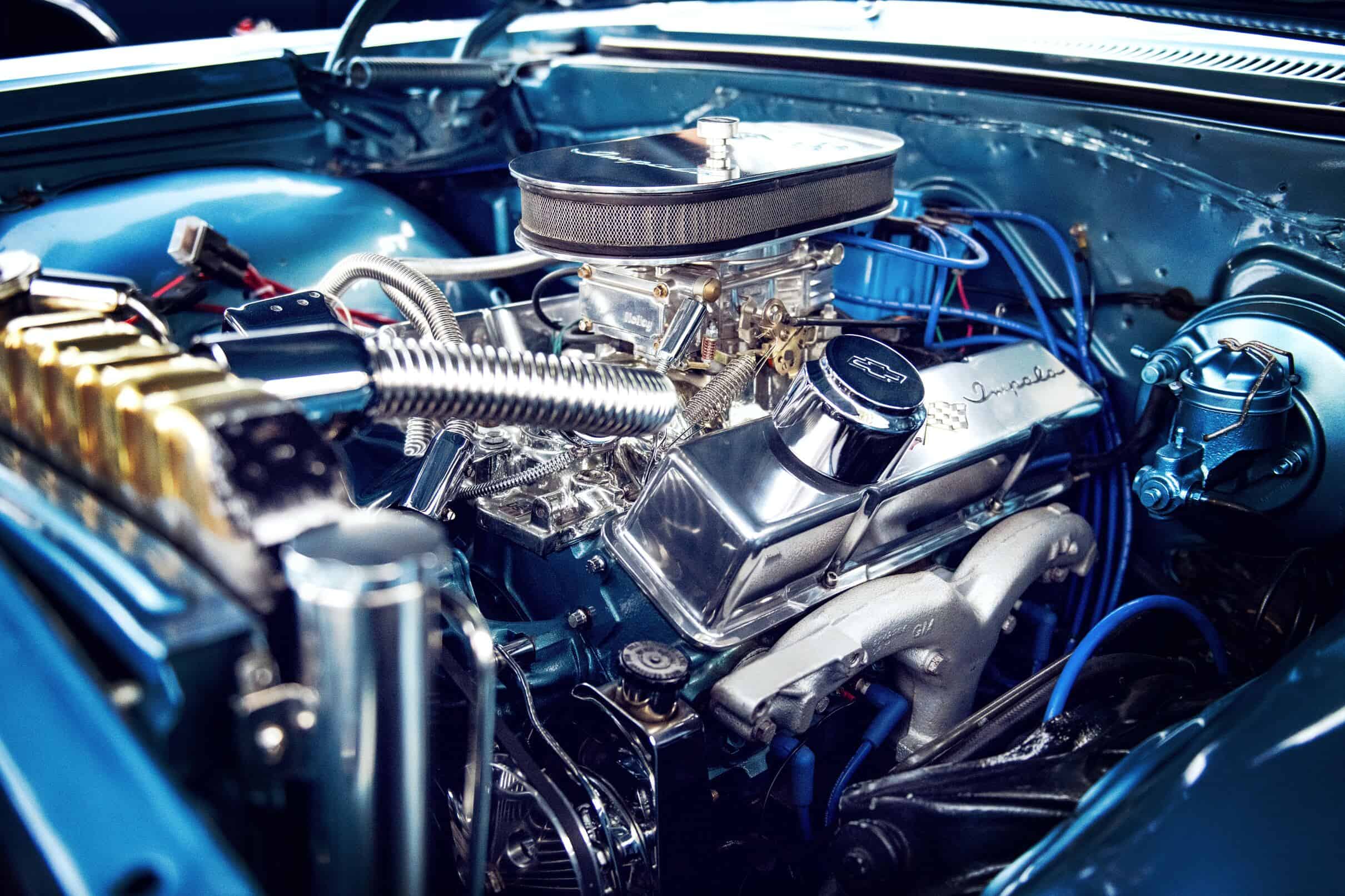 How do headers help improve engine performance?